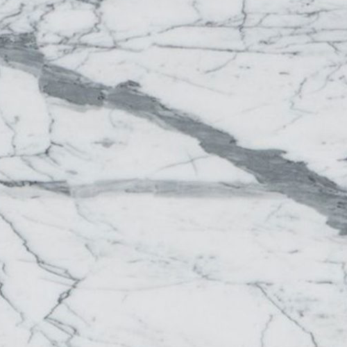 marmol-estatuarieto Mármol Estatuarieto natural con fondo blanco brillante y marcadas vetas grises, ideal para revestimientos, mesadas de baño, mesadas de vanitory y proyectos de interiorismo de alta gama.