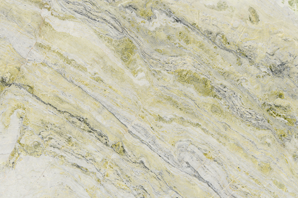 Mármol Fendi Green natural con base clara, matices verdes y amarillos y vetas grises y doradas, ideal para mesadas de baño, revestimientos y proyectos de interiorismo.