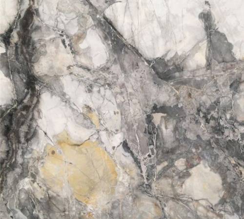 marmol-invisible-grey-gold Mármol Invisible Grey Gold natural de color gris con vetas oscuras y acentos dorados, ideal para revestimientos, mesadas de baño, mesadas de vanitory y proyectos de interiorismo de alta gama.