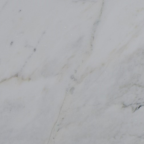 marmol-luxury-white Mármol Luxury White natural con fondo blanco y delicadas vetas grises con sutiles matices marrones, ideal para mesadas de baño, revestimientos y proyectos de interiorismo.