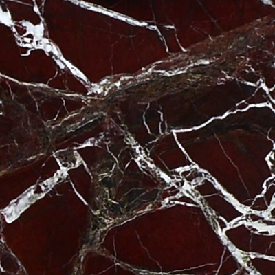 marmol-rosso-levanto-turco Mármol Rosso Levanto Turco natural con fondo rojo oscuro y expresivas vetas blancas irregulares, ideal para mesadas de baño, revestimientos y proyectos de interiorismo.