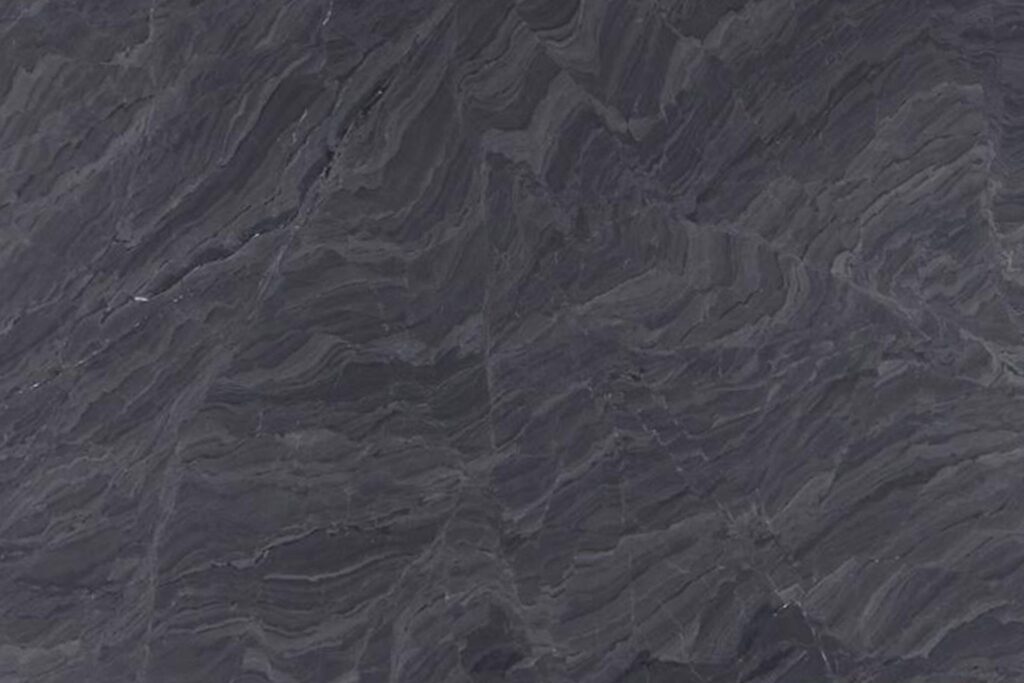 marmol-vittoria Mármol Vittoria natural con fondo gris oscuro y vetas curvas en diferentes tonalidades de gris y sutiles acentos blancos, ideal para mesadas de baño, revestimientos y proyectos de interiorismo.