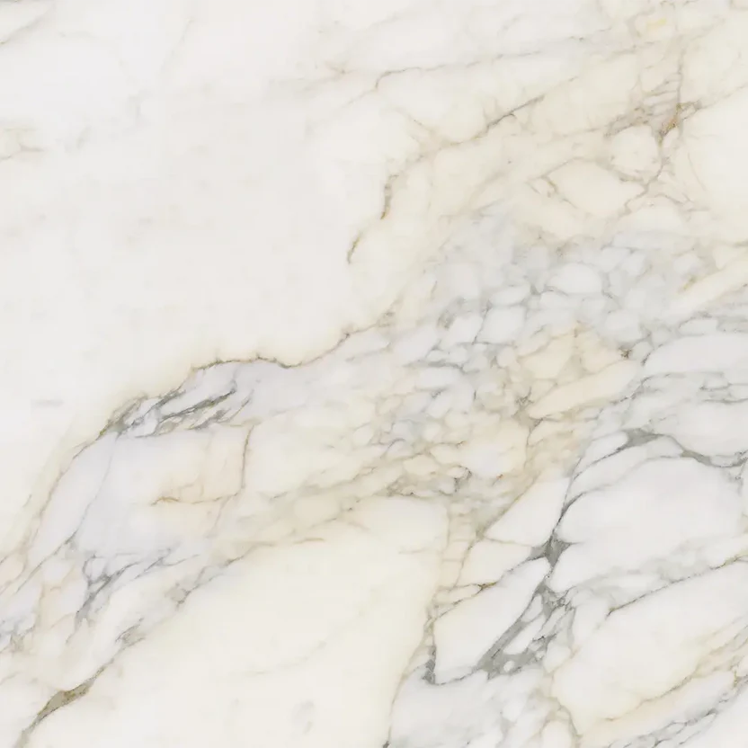 purastone-prima-calacatta-vagli Purastone Prima Calacatta Vagli, superficie sinterizada de fondo marfil con vetas grises y ocres, ideal para mesadas, islas, revestimientos y proyectos de interior y exterior.