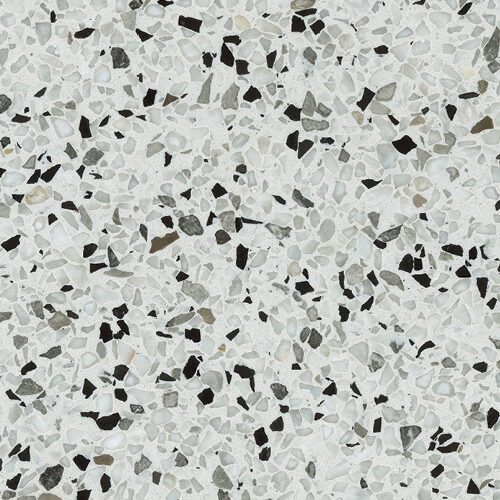 Terrazo New York con base blanca y pequeños fragmentos de mármol en tonos grises y negros, ideal para baños, mesas, pisos y revestimientos.
